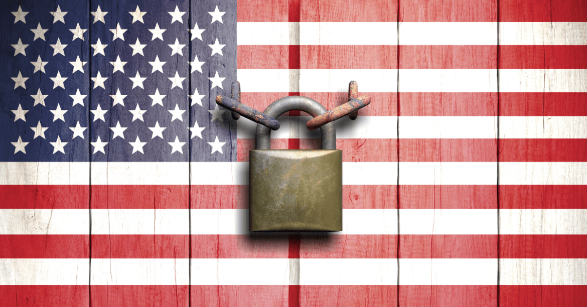 Symbolizing Hope: American flag backdrop with a central padlock - Understanding Asylum Law, a Beacon of Hope in Troubled Times by Ochoa & Hill Law Group, PLLC.
